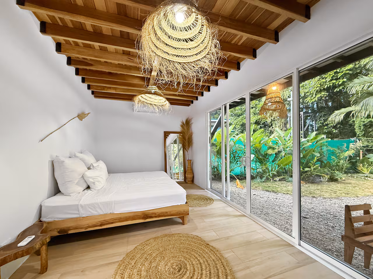 Bedroom window overlooking tropical jungle canopy