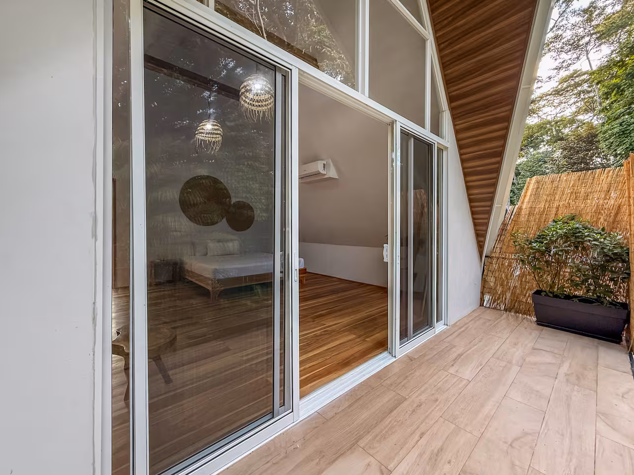 Cozy bedroom design with warm tropical aesthetic