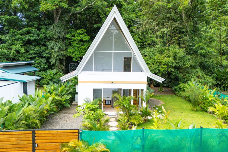 Crystal Jungle Villa A-frame facade with lush tropical garden, Puerto Viejo de Talamanca