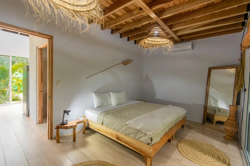 Downstairs bedroom — king bed at Crystal Jungle Villa