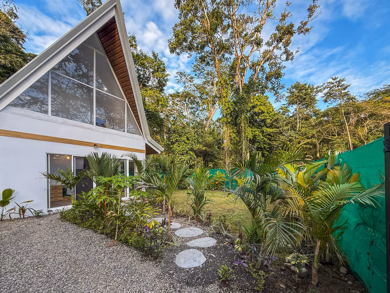 Tropical landscaping and lush greenery surrounding Crystal Jungle Villa